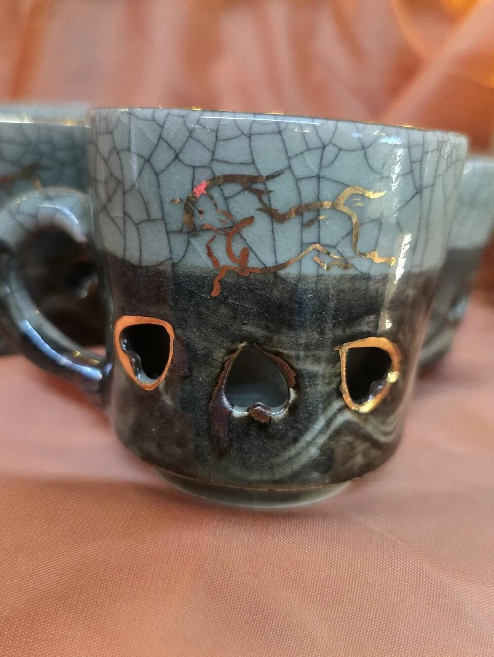 Somayaki tea cups, also known as Soma Ware, featurinright distinct celadon green